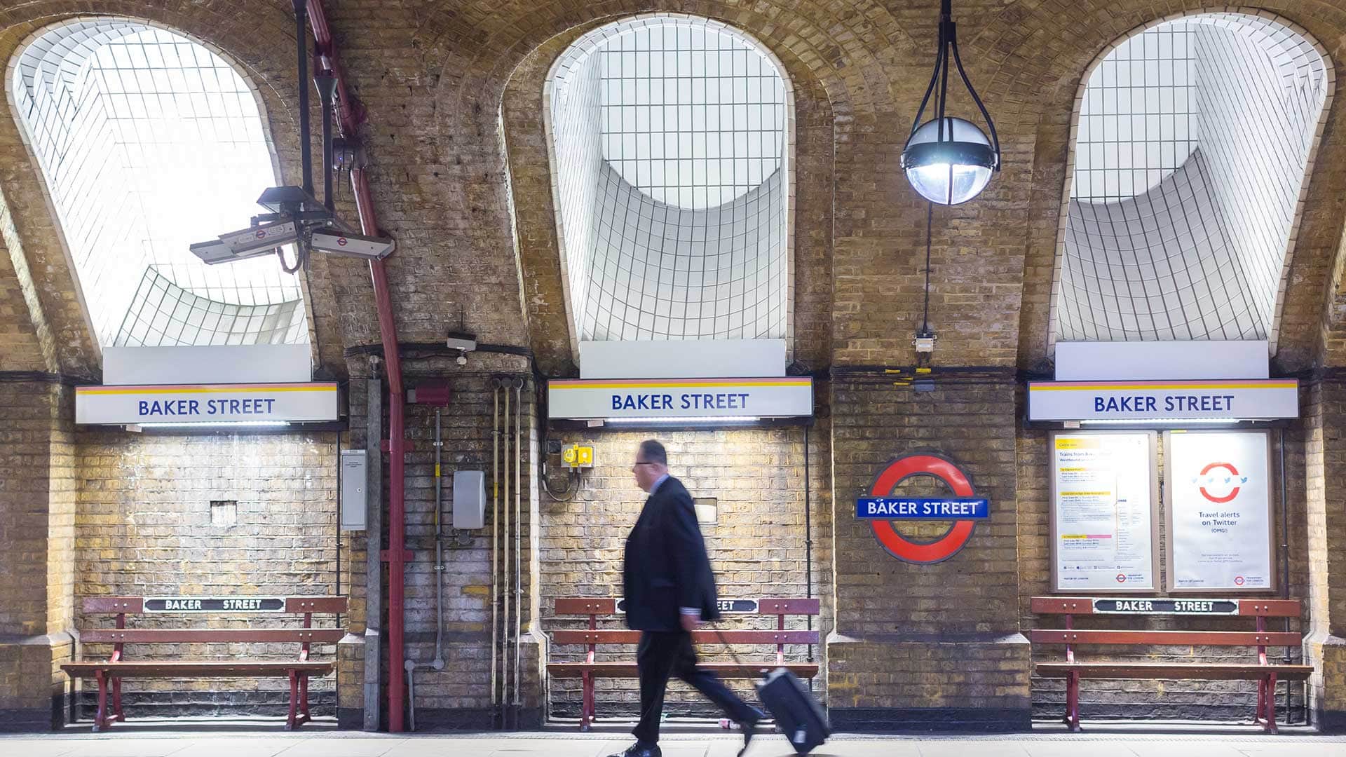 Project title coming soon Business man walking through Baker Street London Underground